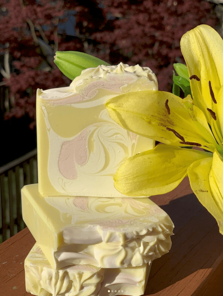 yellow bars of soap with lily flower display