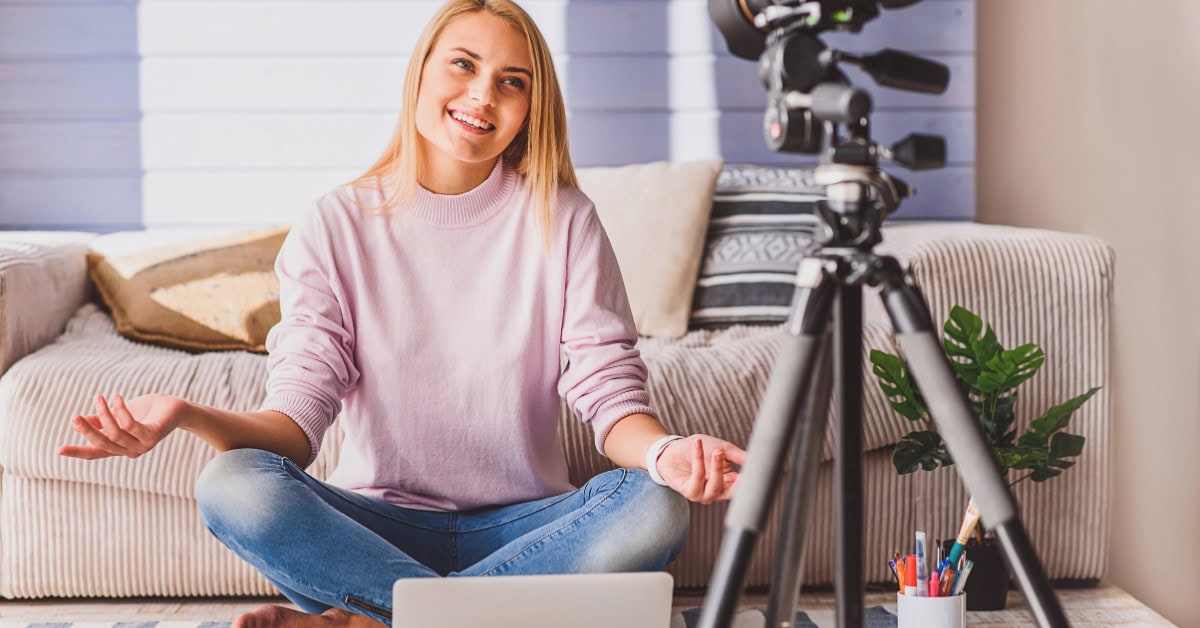 woman sitting in front of camera - how to make 6 figures with online courses