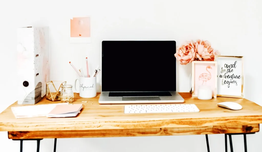 lyrical-host-wooden-desk-with-laptop-keyboard-pink-stationery-accessories